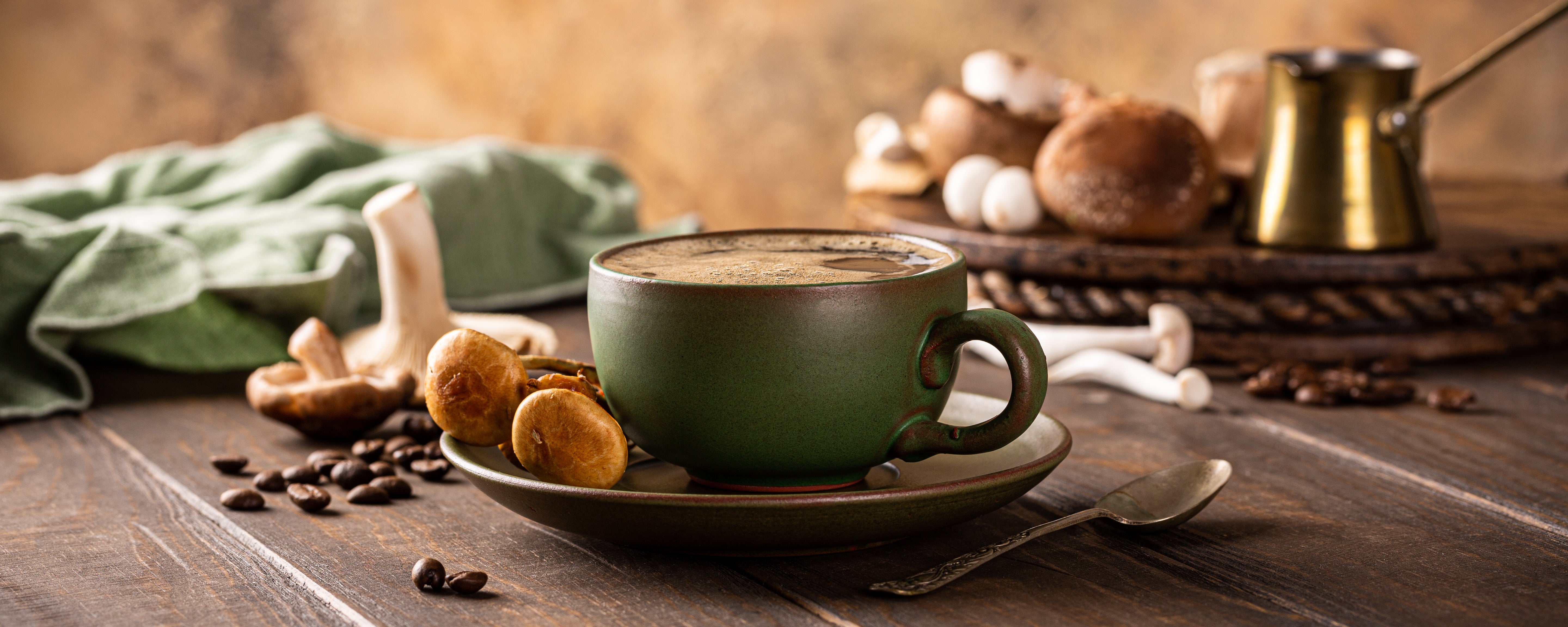 Adding mushroom powder to coffee. 